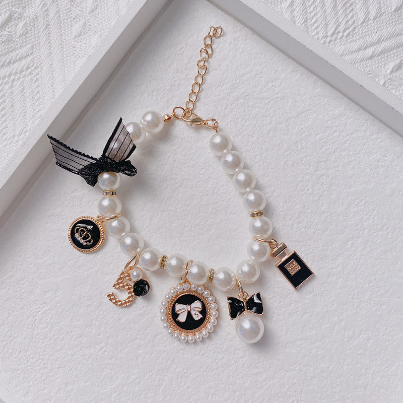 Black 4-PCS Pearl Charm Pet Necklace - Adjustable Bowknot Collar for Small Dogs & Cats (S: 20+5CM) - Pets Preference